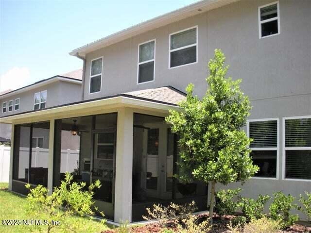 46 Molasses Court Fruit Cove, FL 32259 - Photo 7 of 17 a front view of a house with a garden