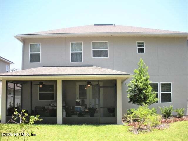 46 Molasses Court Fruit Cove, FL 32259 - Photo 8 of 17 a front view of a house with a yard