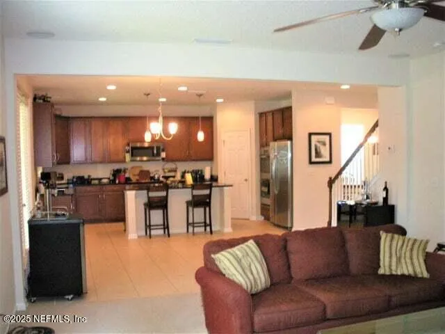 a view of kitchen with dining table and chairs