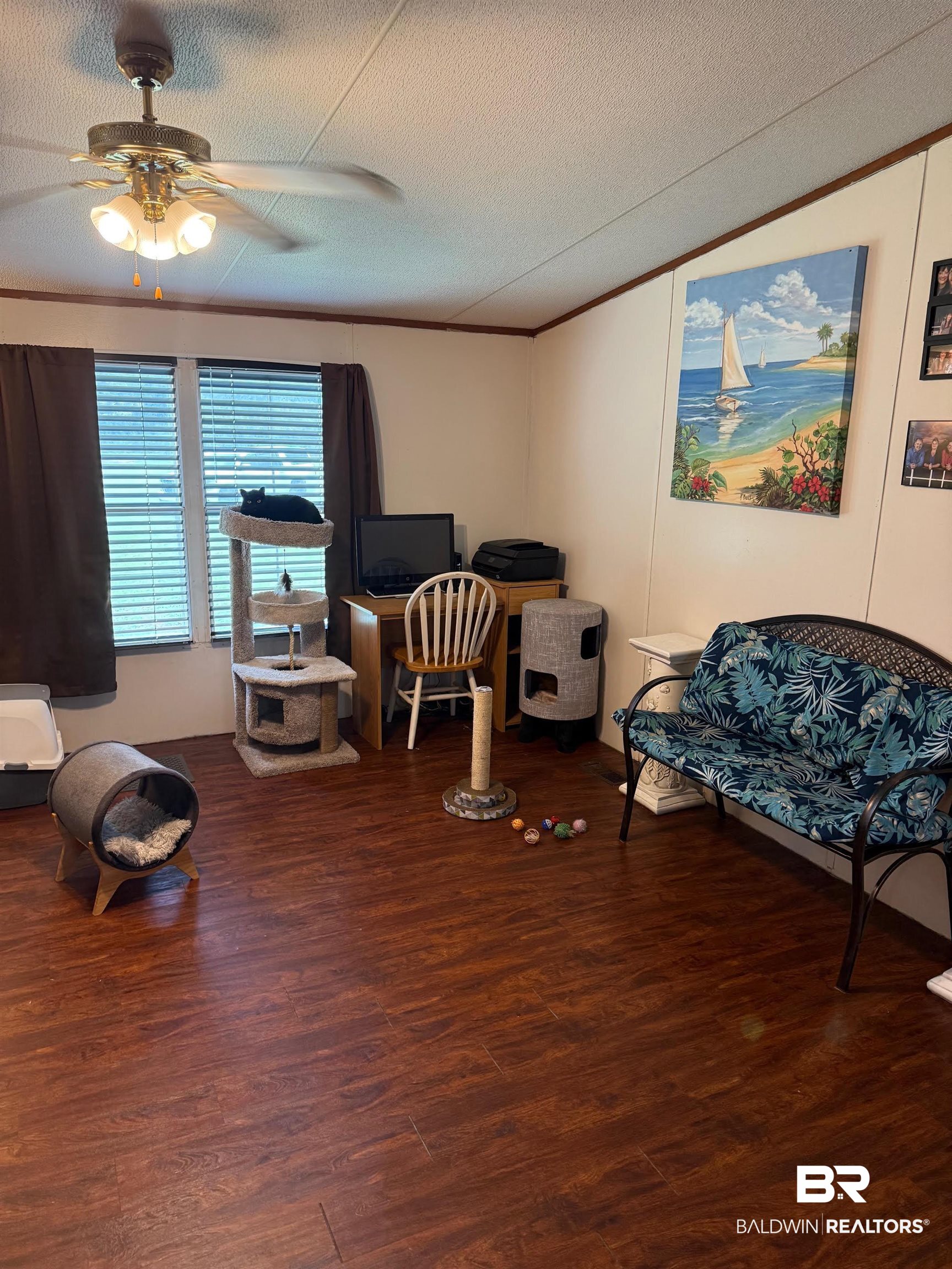15844 County Road 87 Elberta, AL 36530 - Photo 27 of 28 Living area with ceiling fan, hardwood / wood-style flooring, and a textured ceiling