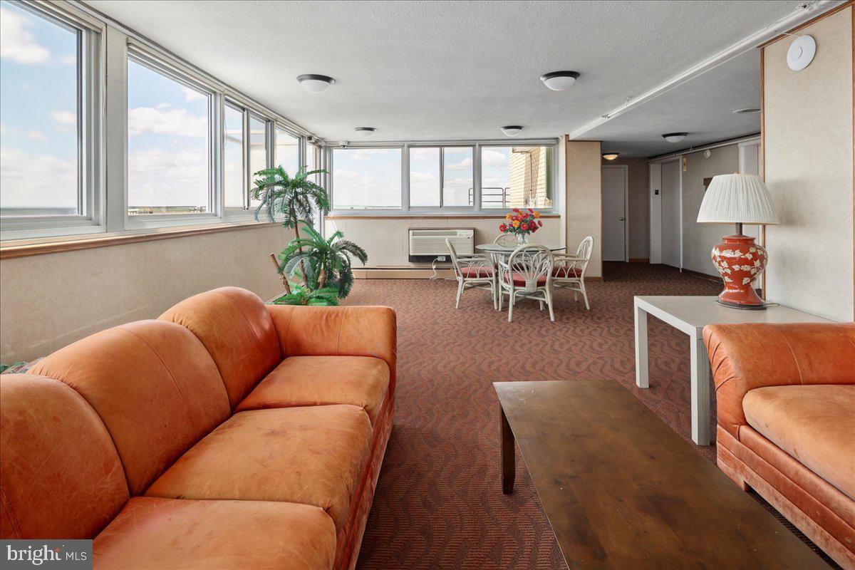 9701 Fields Road, Unit 1408 Gaithersburg, MD 20878 - Photo 26 of 29 a living room with furniture and a large window