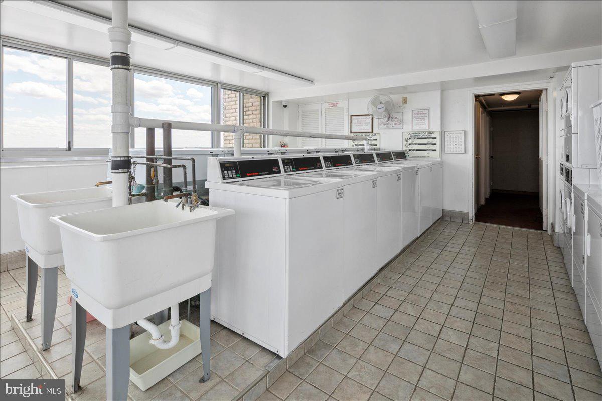 9701 Fields Road, Unit 1408 Gaithersburg, MD 20878 - Photo 28 of 29 a kitchen with a sink cabinets and window