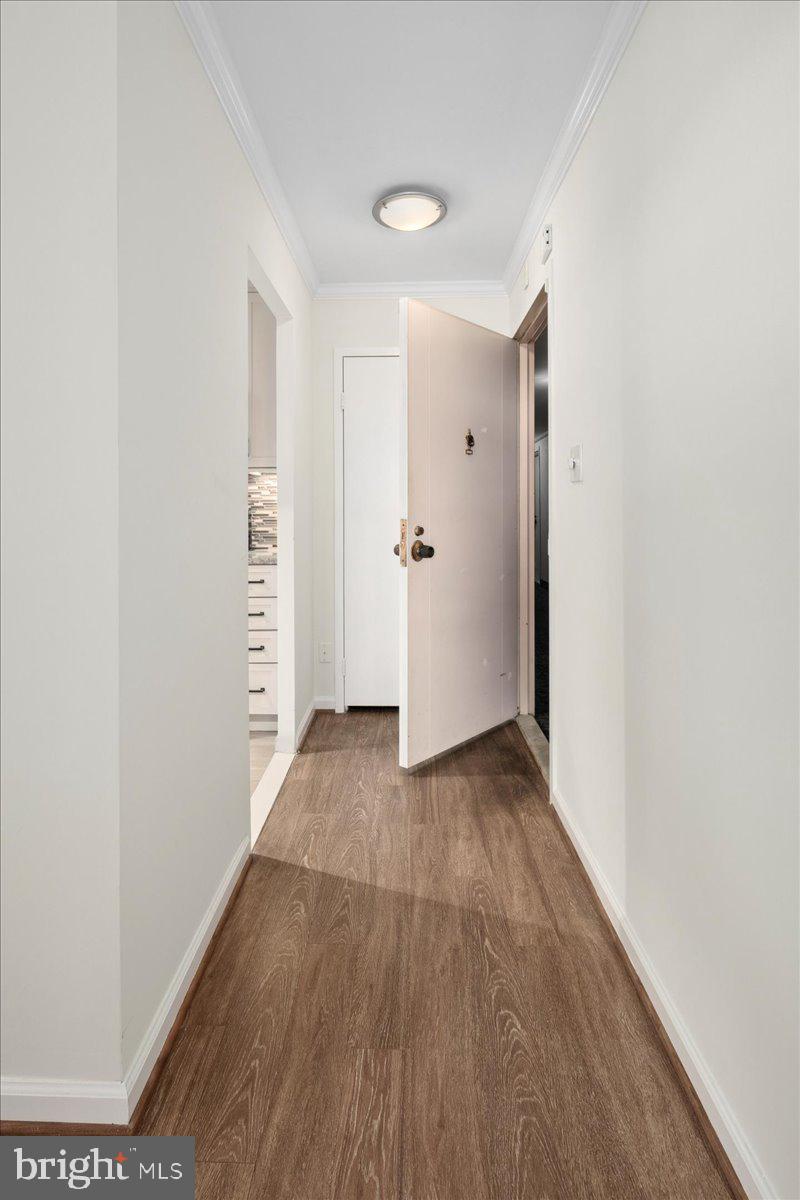 9701 Fields Road, Unit 1408 Gaithersburg, MD 20878 - Photo 7 of 29 a view of hallway with wooden floor