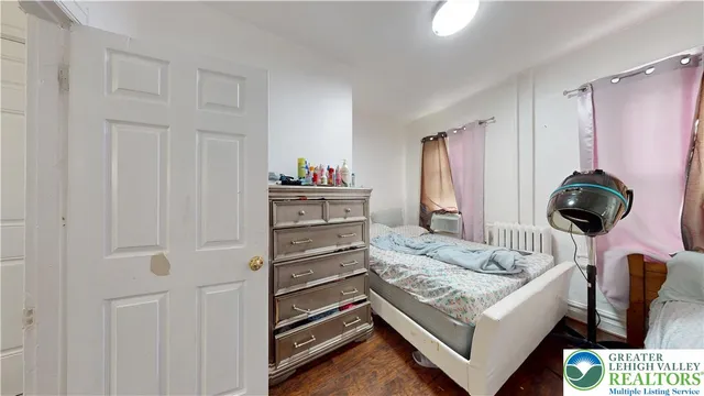 a kitchen with granite countertop a white stove top oven and cabinets