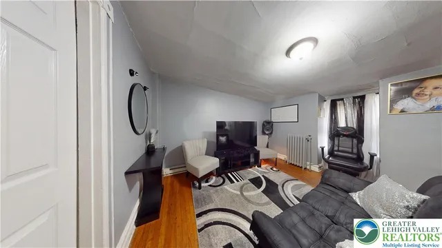 a view of a room with workspace and a window