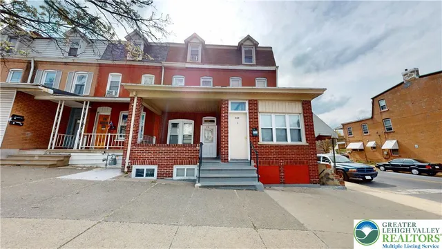 a view of multiple houses with a street