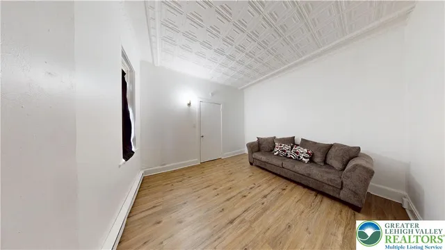 a bedroom with a bed and a table