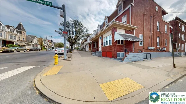 a view of a building with cars