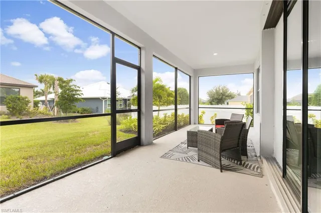 a balcony with furniture and a yard