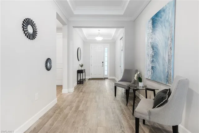 a view of a hallway with seating area