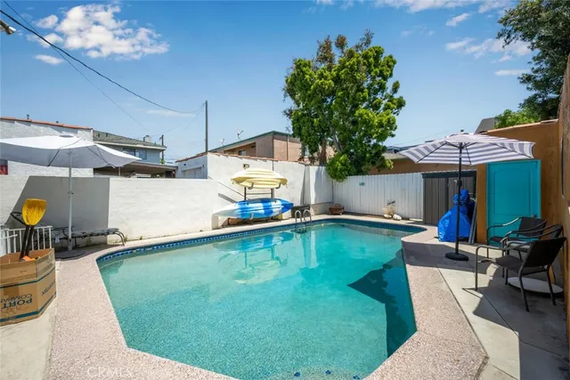 a swimming pool with outdoor seating