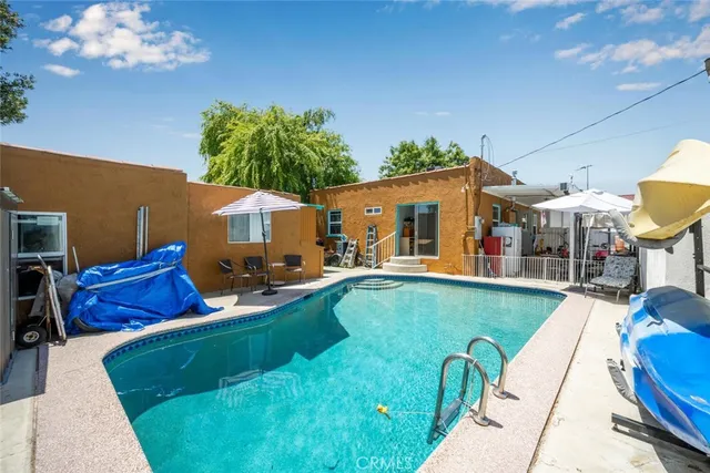 a view of a swimming pool with a patio