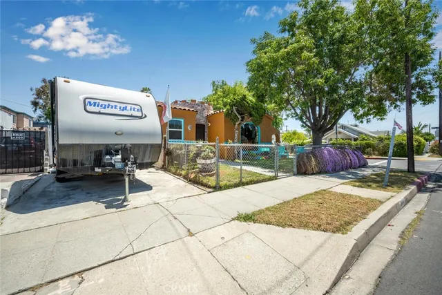 a view of a patio with a table and chairs