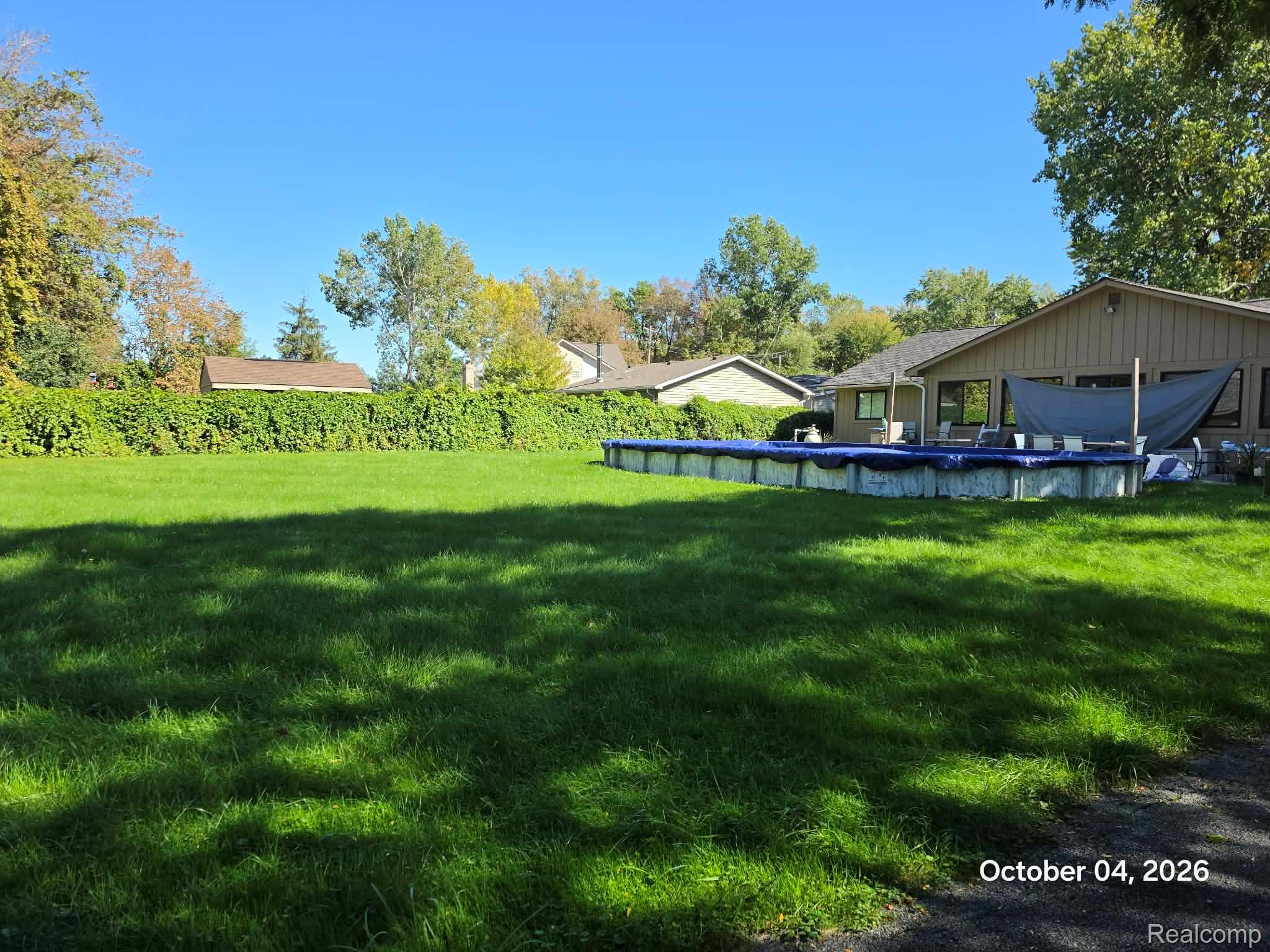 34781 Union Lake Road Clinton Township, MI 48035 - Photo 38 of 38 Expansive lawn area with mature perimeter foliage