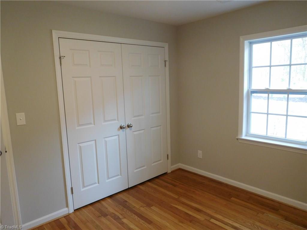 144 Hauser Road Lewisville, NC 27023 - Photo 12 of 21 2nd Bedroom. Both Bedrooms have double door closets. There is actually a good amount of storage space in this home.