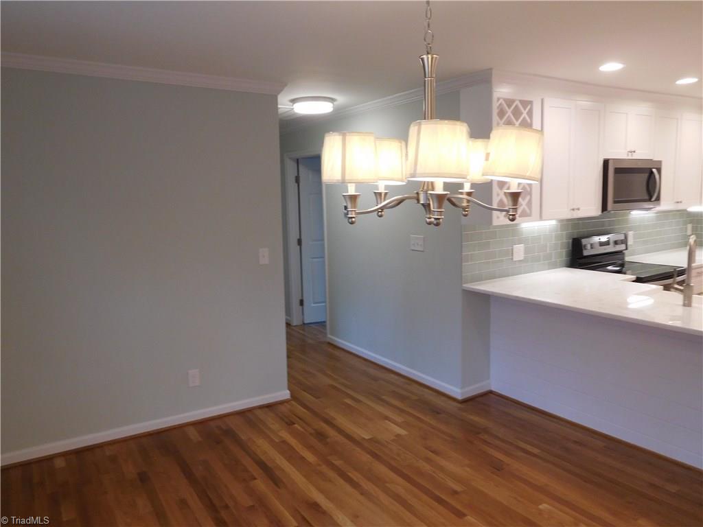 144 Hauser Road Lewisville, NC 27023 - Photo 2 of 21 Dining room located at the front of the home. Easy flow. New paint, crown & fixtures.