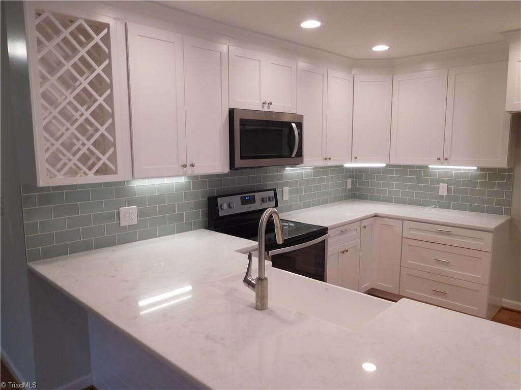 144 Hauser Road Lewisville, NC 27023 - Photo 5 of 21 Plenty of cabinet and counter space.