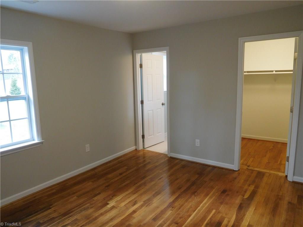 144 Hauser Road Lewisville, NC 27023 - Photo 9 of 21 Master Bedroom. Walk-in Closet. Hardwoods continue throughout home.