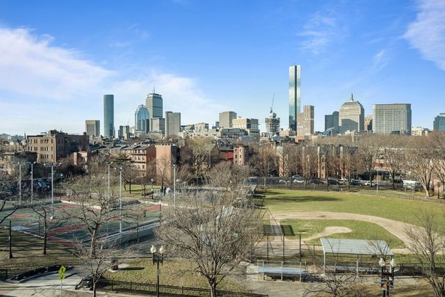 a view of a city with tall buildings