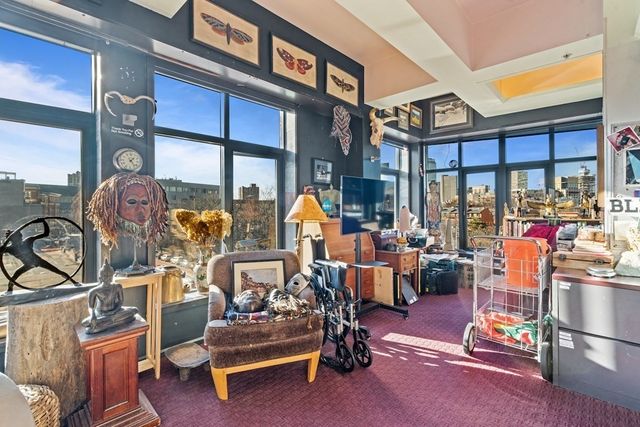 a living room with lots of gym equipment