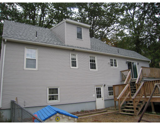 46 Crest Road Monson, MA 01057 - Photo 4 of 17 a view of a house with wooden deck and backyard