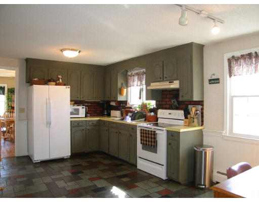 46 Crest Road Monson, MA 01057 - Photo 7 of 17 a kitchen with stainless steel appliances a stove a refrigerator sink and cabinets