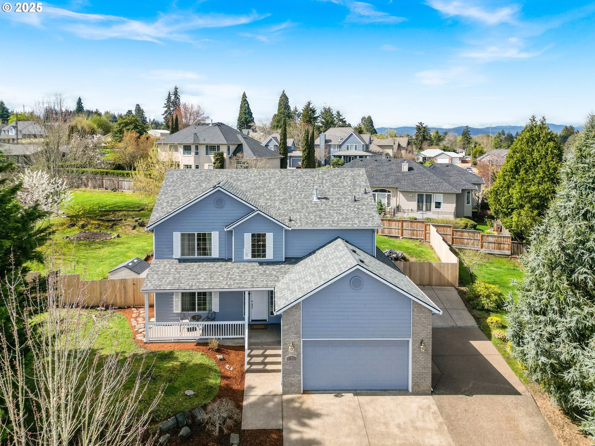 a aerial view of a house with a yard