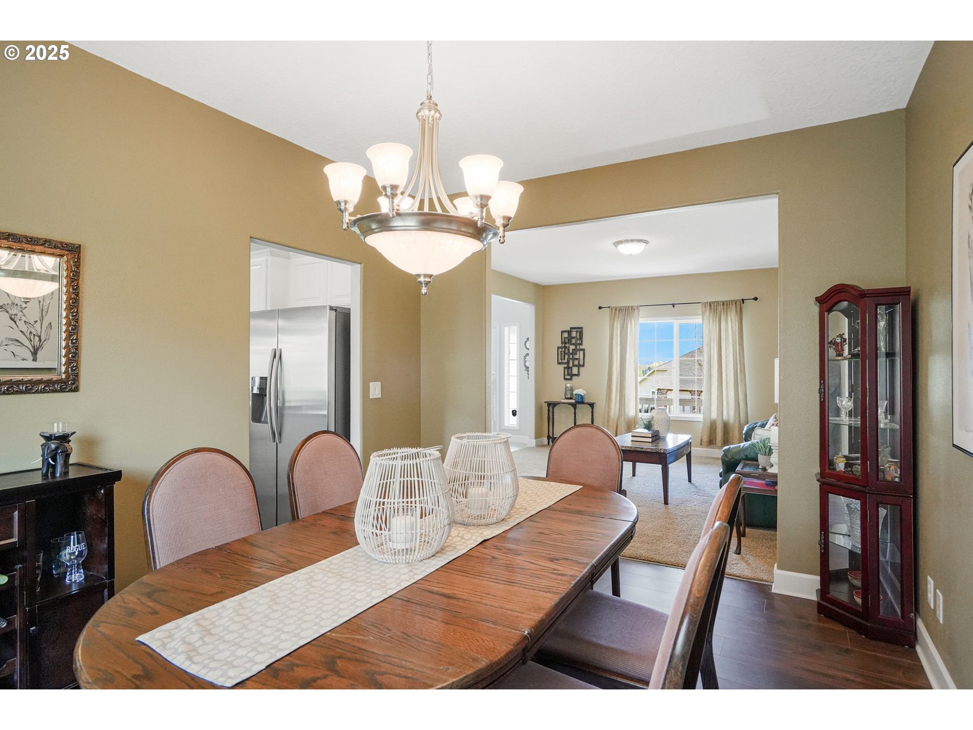 1832 Northwest Olivia Circle Albany, OR 97321 - Photo 14 of 48 a view of a dining room with furniture and chandelier