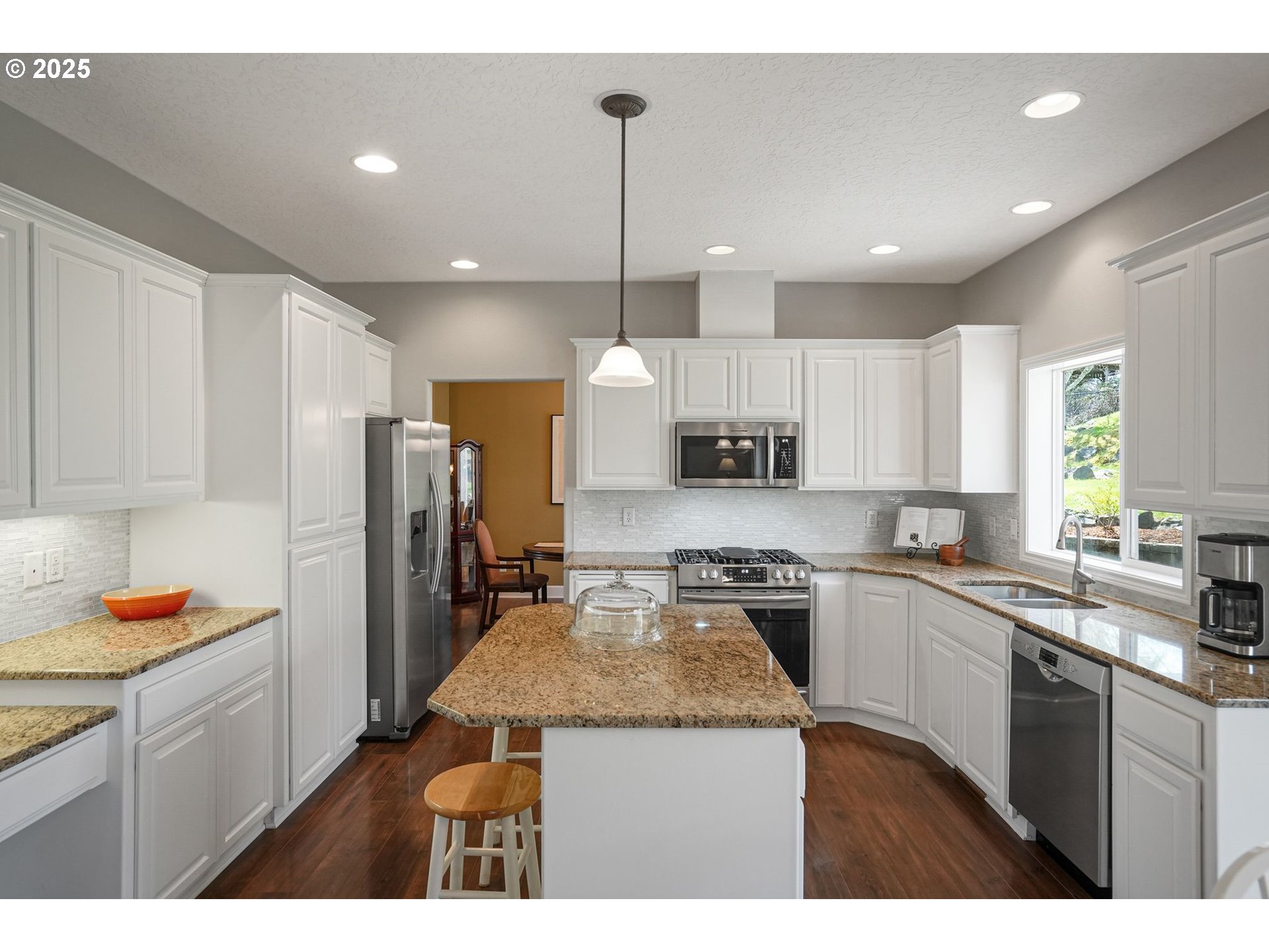 1832 Northwest Olivia Circle Albany, OR 97321 - Photo 17 of 48 a kitchen with stainless steel appliances granite countertop a sink refrigerator and cabinets