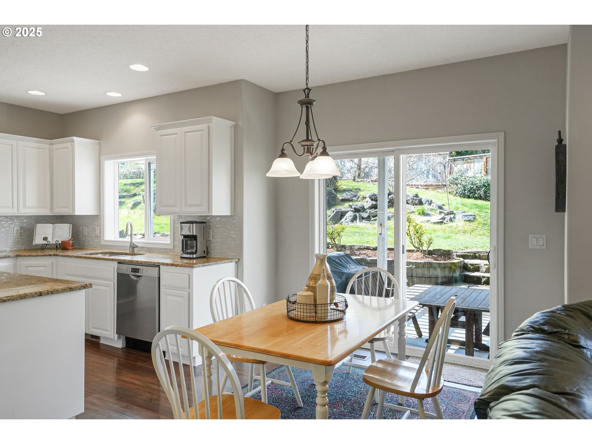1832 Northwest Olivia Circle Albany, OR 97321 - Photo 20 of 48 a kitchen with a table chairs and wooden floor