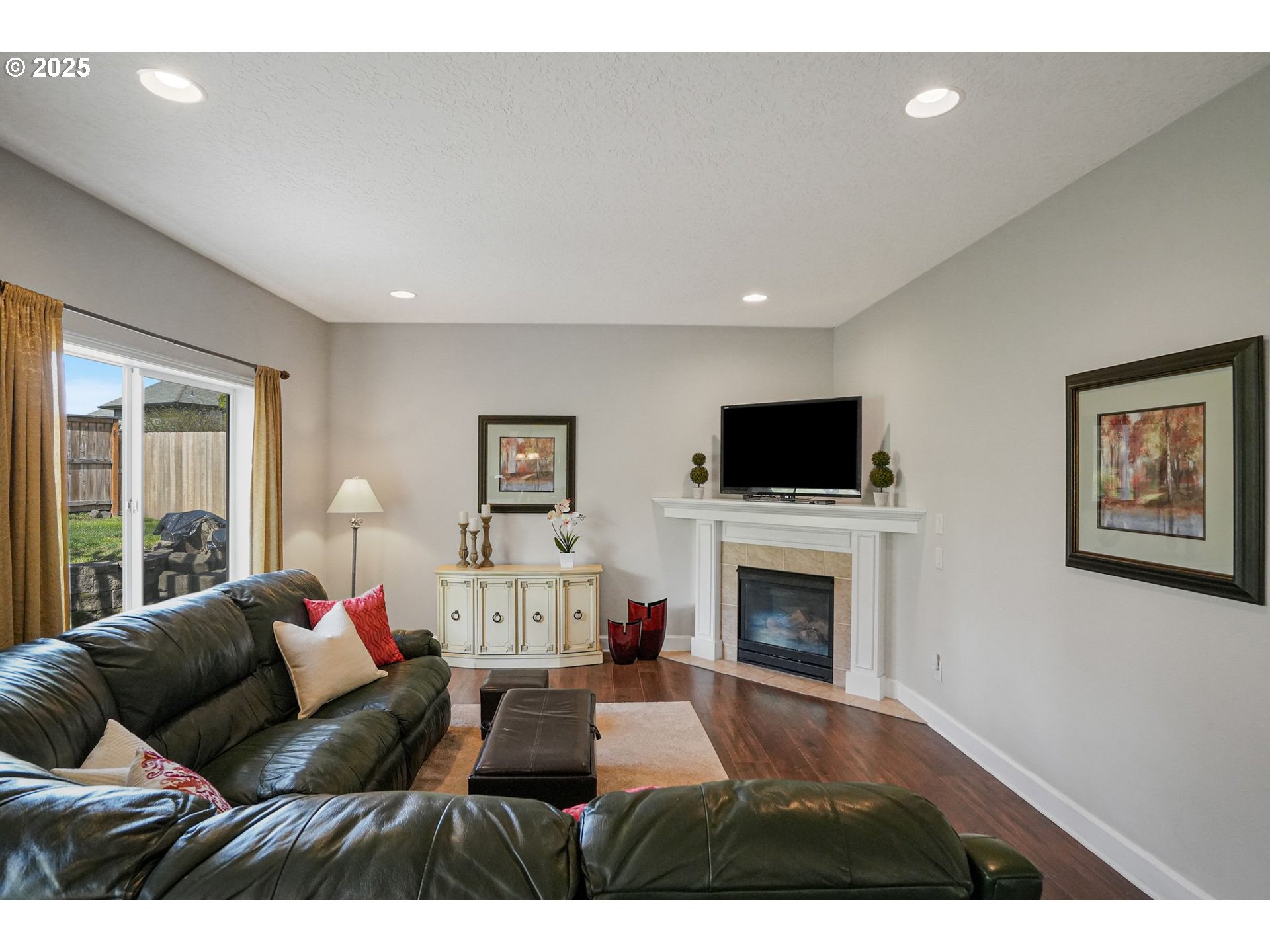 1832 Northwest Olivia Circle Albany, OR 97321 - Photo 23 of 48 a living room with furniture flat screen tv and a fireplace