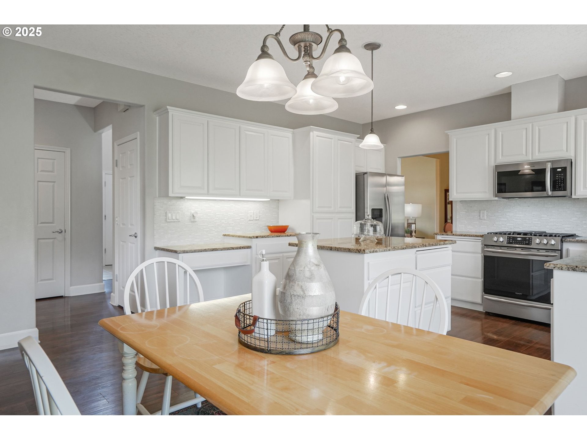1832 Northwest Olivia Circle Albany, OR 97321 - Photo 25 of 48 a kitchen with kitchen island a white counter top space a sink and cabinets