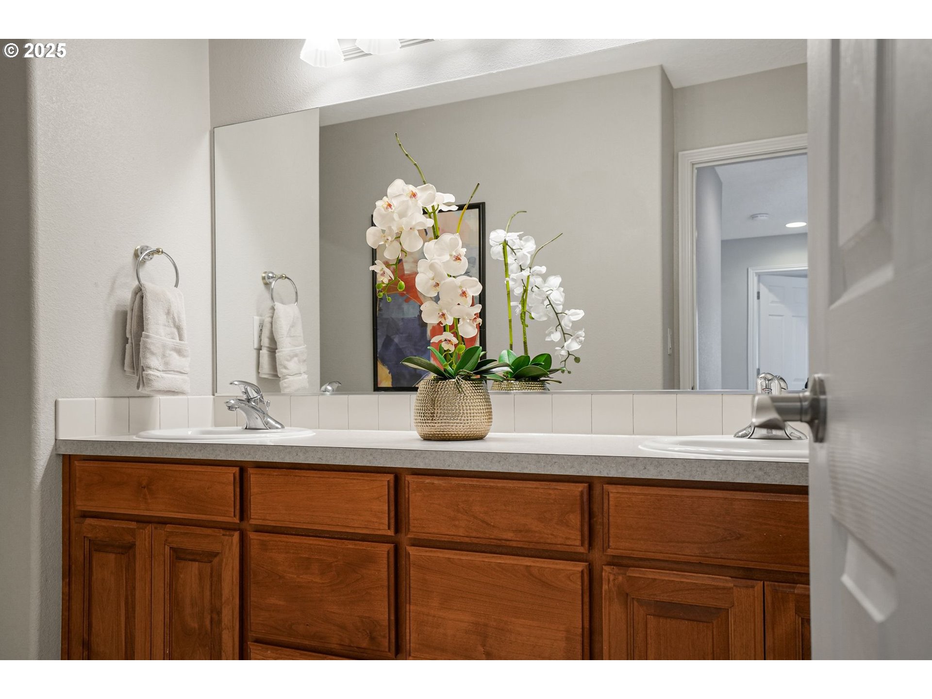 1832 Northwest Olivia Circle Albany, OR 97321 - Photo 39 of 48 a bathroom with a sink a potted plant and a mirror