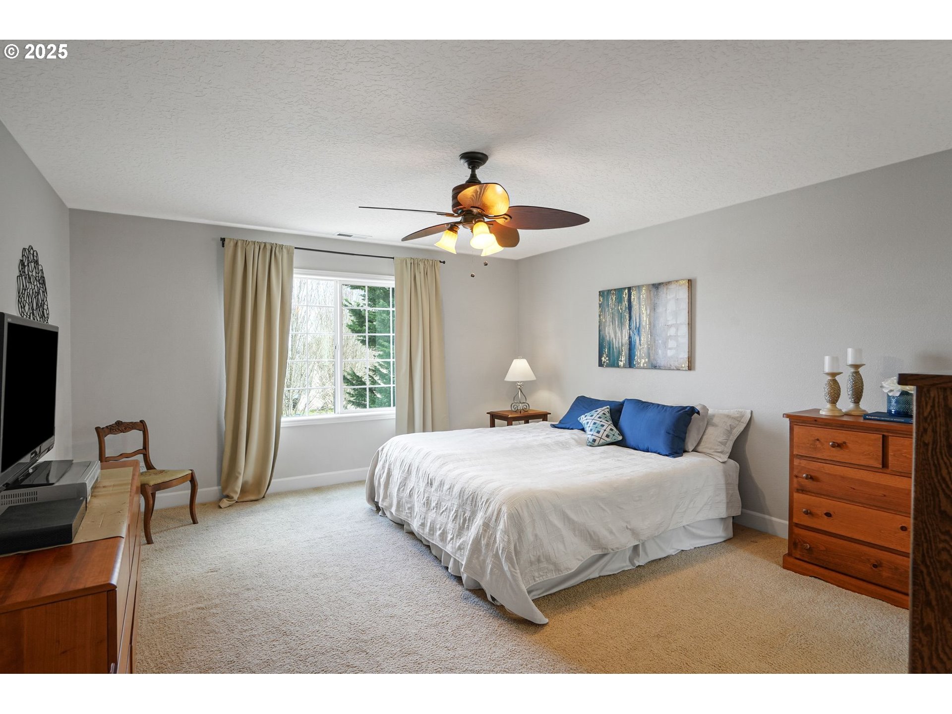 1832 Northwest Olivia Circle Albany, OR 97321 - Photo 42 of 48 a bedroom with a bed and a chandelier