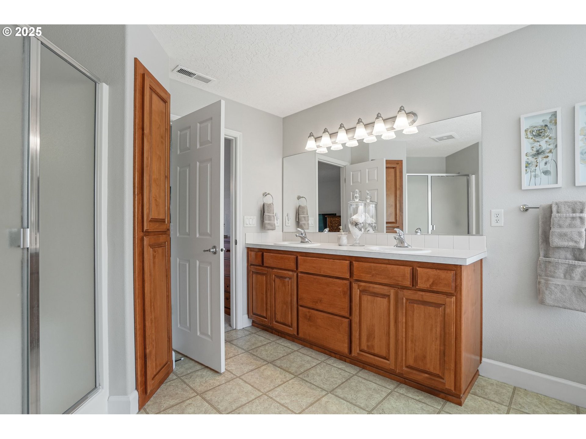 1832 Northwest Olivia Circle Albany, OR 97321 - Photo 46 of 48 a spacious bathroom with a granite countertop sink a mirror and a shower