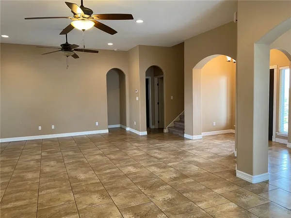 a view of an empty room with windows