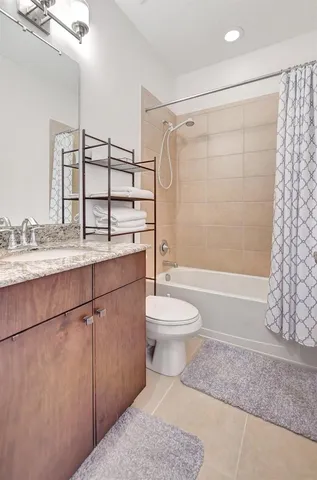 a bedroom with a bed and a view of bathroom