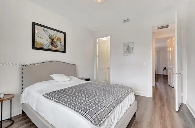 a dining room with wooden floor and breakfast area