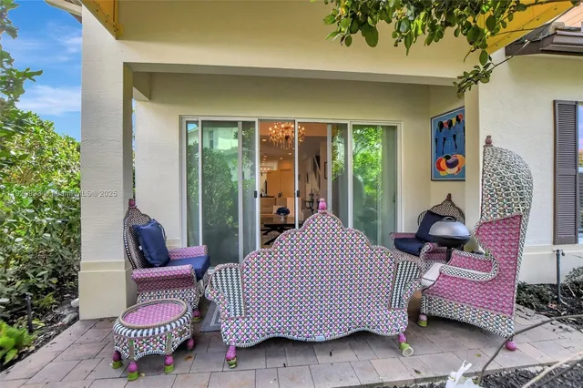 a outdoor space with a couch and chairs
