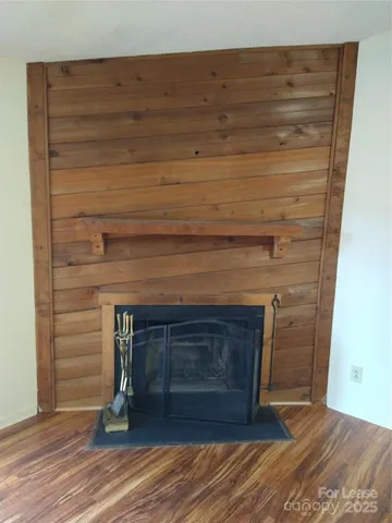 a fireplace with a wooden floor