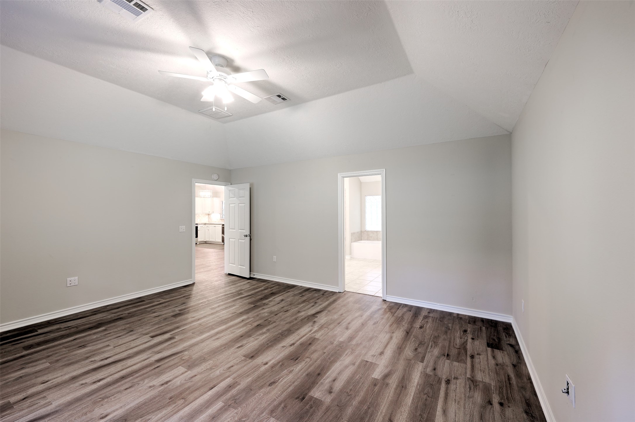 3131 Sapp Road Conroe, TX 77304 - Photo 19 of 48 wooden floor in an empty room with a window