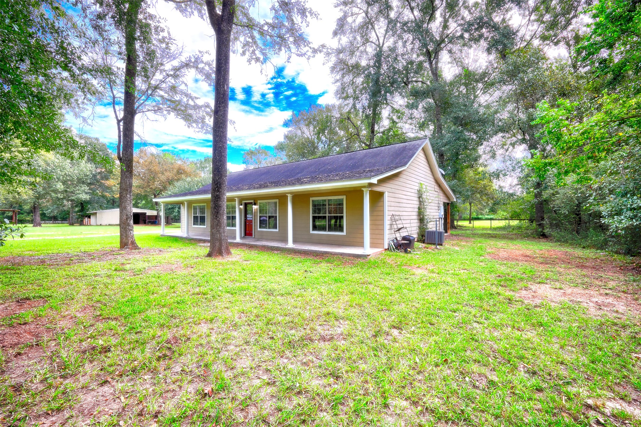 3131 Sapp Road Conroe, TX 77304 - Photo 2 of 48 a view of a house with backyard and a tree