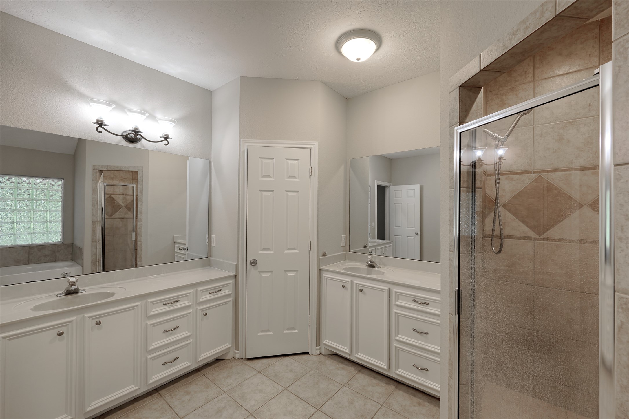 3131 Sapp Road Conroe, TX 77304 - Photo 21 of 48 a bathroom with a double vanity sink mirror and double