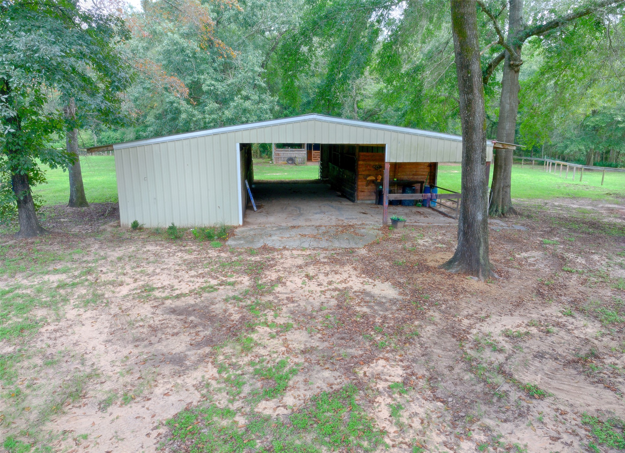 3131 Sapp Road Conroe, TX 77304 - Photo 31 of 48 a view of a house with a yard and sitting area