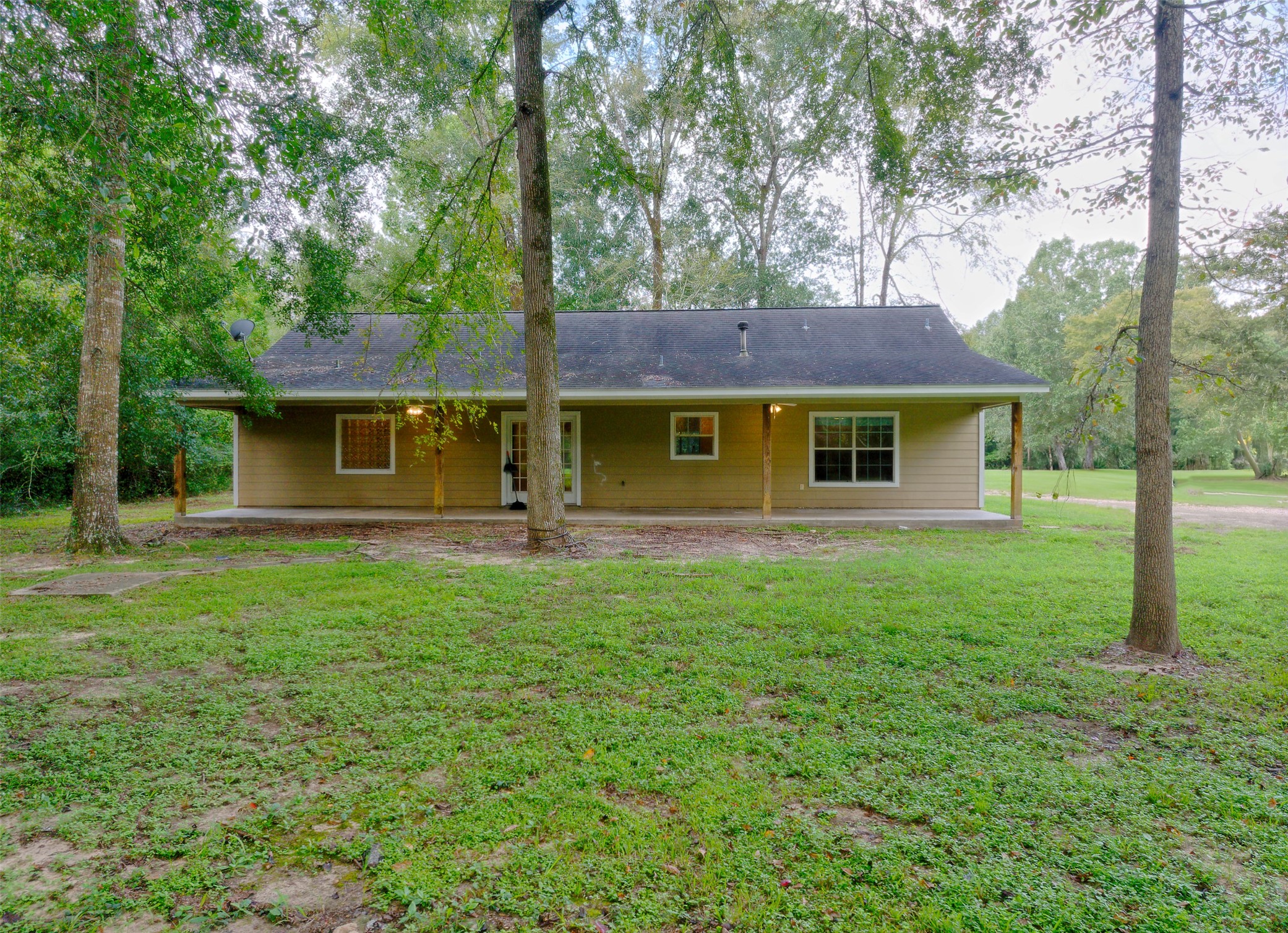 3131 Sapp Road Conroe, TX 77304 - Photo 45 of 48 a view of a house with a backyard