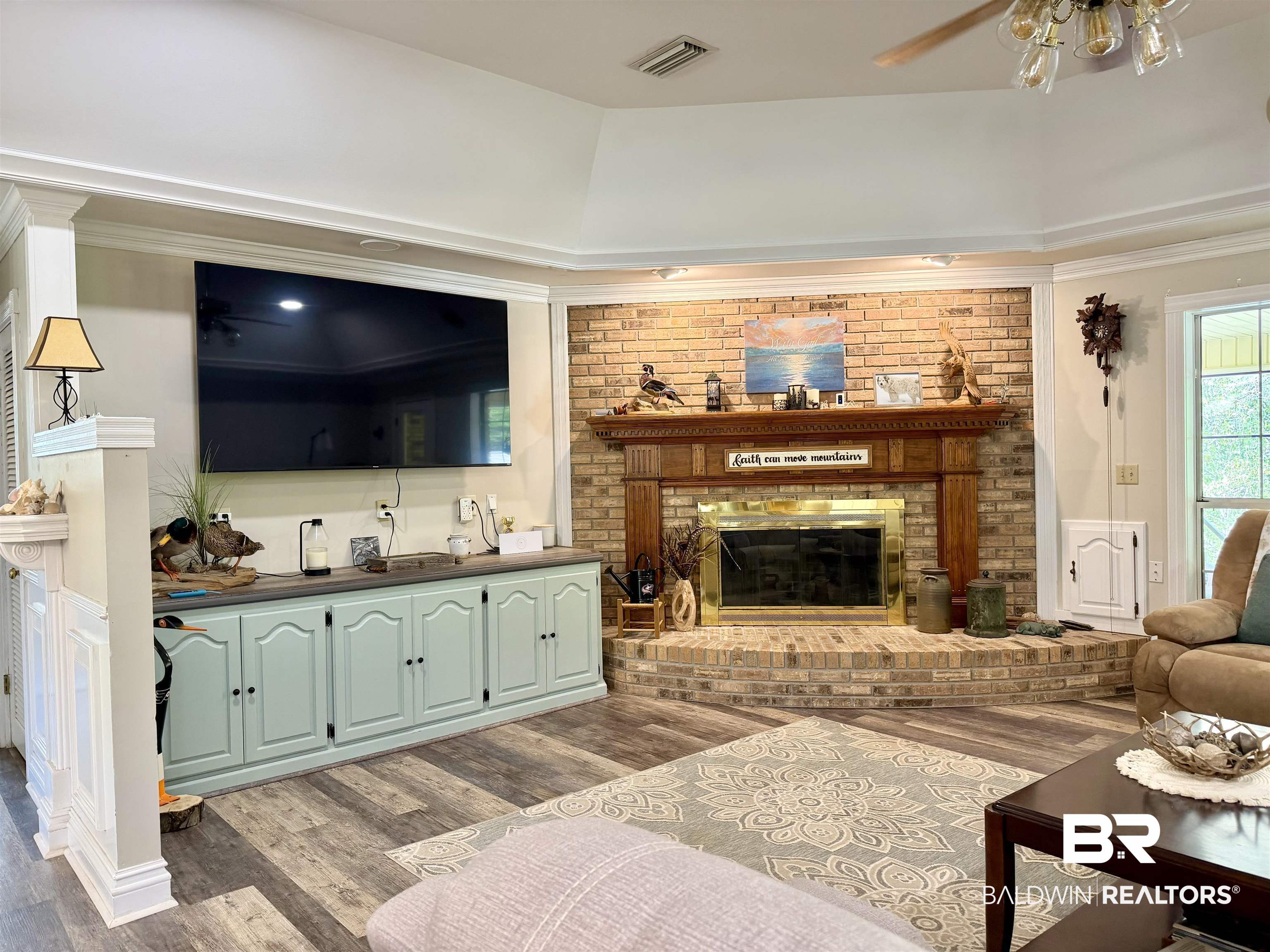 2944 Appleton Road Brewton, AL 36426 - Photo 10 of 65 Living room featuring a brick fireplace, dark wood-style floors, and ceiling fan