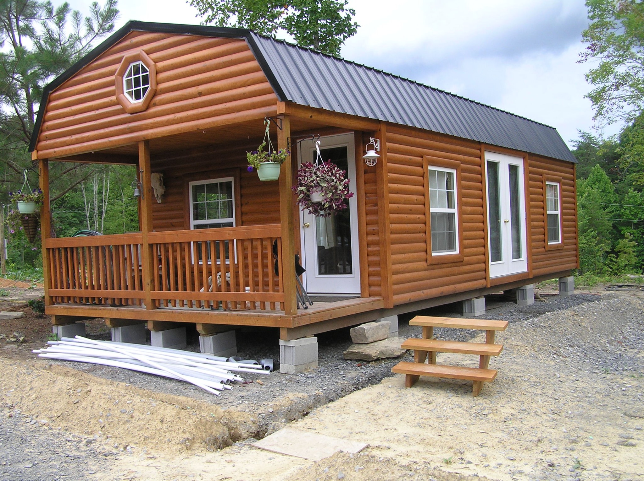 8766 Fredonia Road Dunlap, TN 37327 - Photo 4 of 41 a view of a house with a wooden deck and furniture