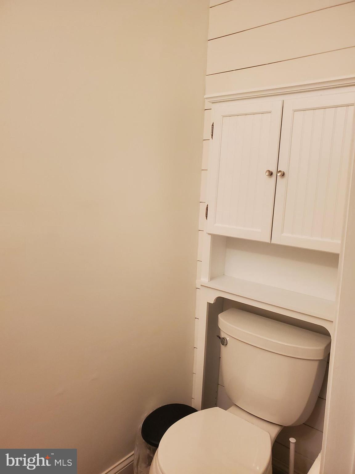 106 Five Crown Royal Marlton, NJ 08053 - Photo 11 of 27 a white toilet sitting next to a white cabinet