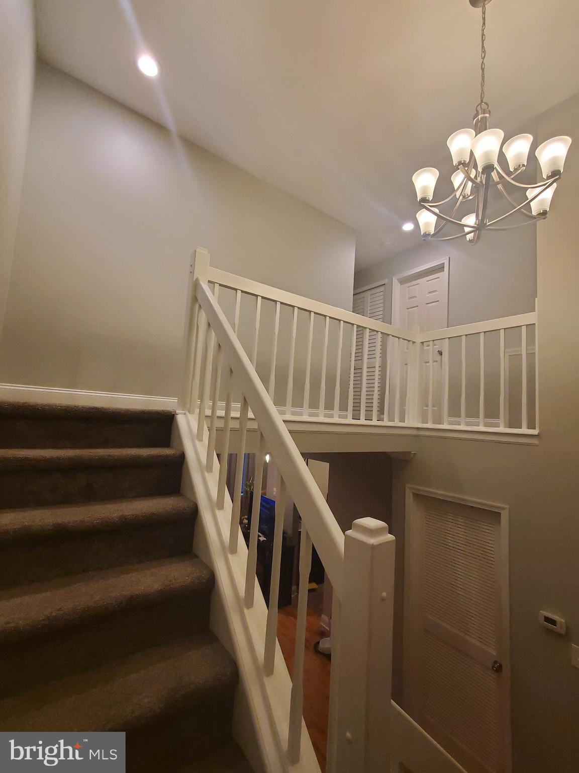 106 Five Crown Royal Marlton, NJ 08053 - Photo 14 of 27 a view of entryway and hall with wooden floor