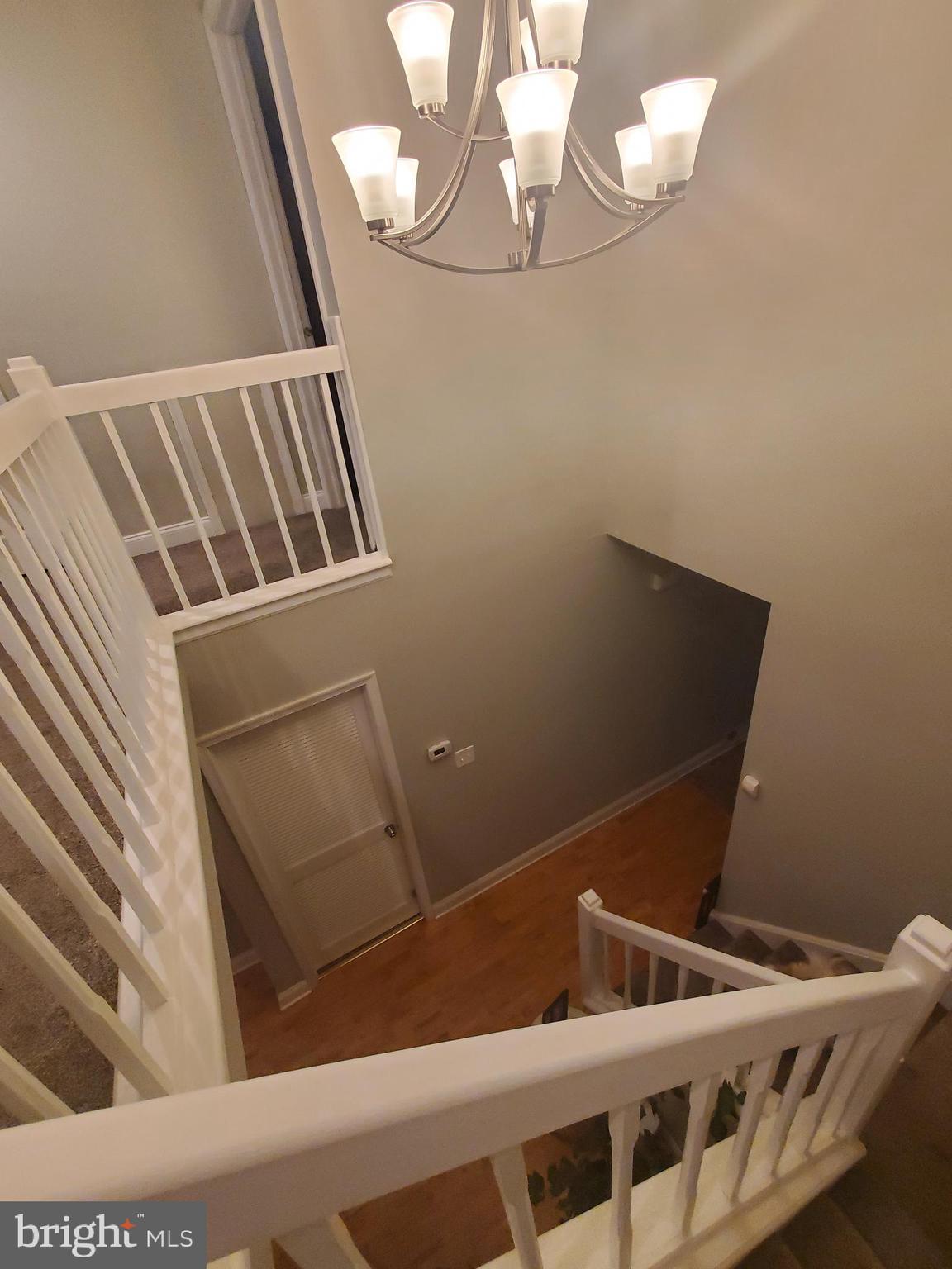 106 Five Crown Royal Marlton, NJ 08053 - Photo 15 of 27 a view of an empty room with wooden floor